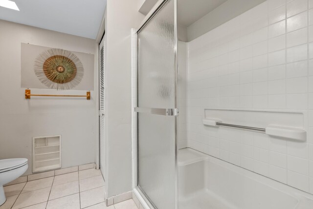 75-6082 Alii Dr Unit A103, Kailua-Kona, HI 96740 - bathroom with a stall shower, toilet, and tile patterned flooring