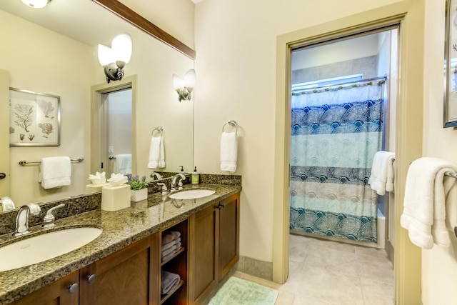 bathroom featuring a sink, tile patterned floors, double vanity, and shower / tub combo with curtain
