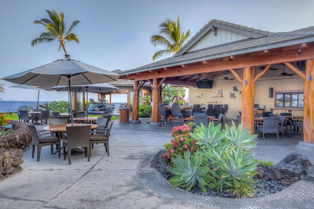 view of patio with ceiling fan and outdoor dining space
