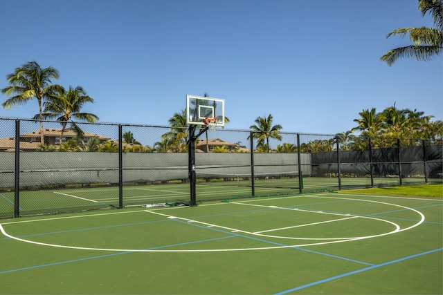 view of basketball court featuring fence and community basketball court