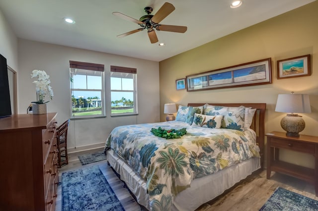 bedroom featuring recessed lighting, baseboards, ceiling fan, and wood finished floors