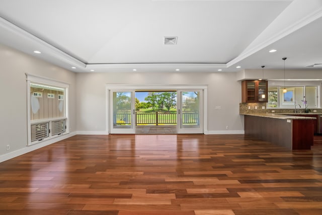 2326 Wiliko St, Lihue, HI 96766 - unfurnished living room featuring dark wood-style flooring, visible vents, baseboards, lofted ceiling, and recessed lighting