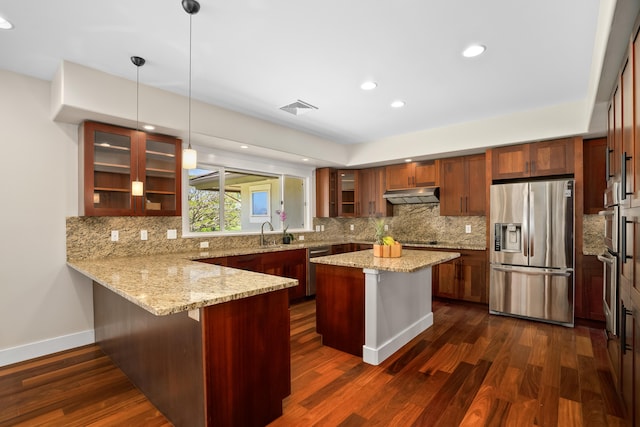 2326 Wiliko St, Lihue, HI 96766 - kitchen featuring visible vents, dark wood-style flooring, a peninsula, under cabinet range hood, and appliances with stainless steel finishes