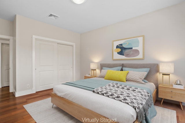 2326 Wiliko St, Lihue, HI 96766 - bedroom with baseboards, visible vents, wood finished floors, and a closet