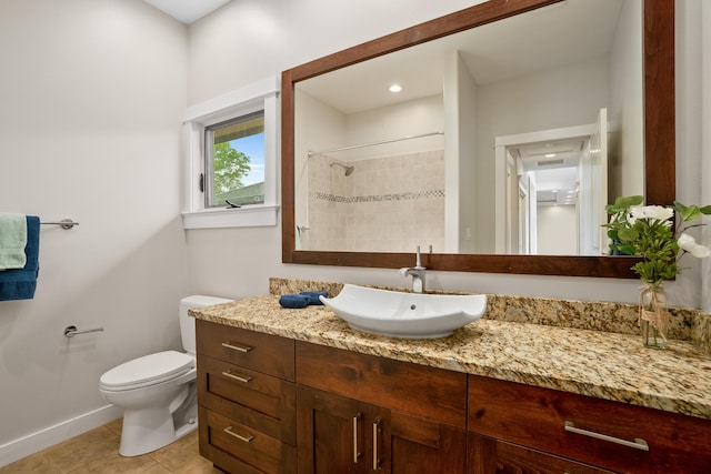 2326 Wiliko St, Lihue, HI 96766 - full bathroom with tile patterned flooring, vanity, baseboards, toilet, and tiled shower