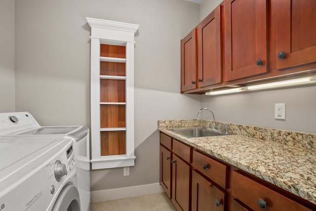 2326 Wiliko St, Lihue, HI 96766 - laundry area featuring washer and dryer, cabinet space, a sink, baseboards, and light tile patterned floors