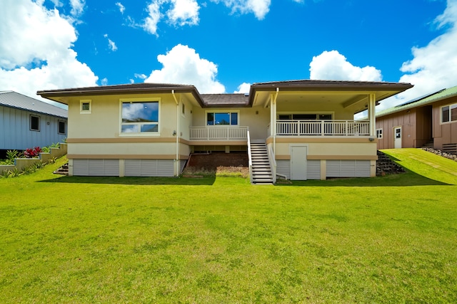 2326 Wiliko St, Lihue, HI 96766 - back of property featuring stairs, a lawn, and stucco siding