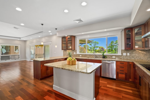 2326 Wiliko St, Lihue, HI 96766 - kitchen featuring stainless steel dishwasher, a tray ceiling, dark wood finished floors, and a center island