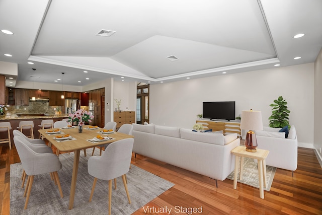 2326 Wiliko St, Lihue, HI 96766 - dining room with a tray ceiling, visible vents, and light wood-style flooring