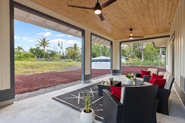 view of patio with a ceiling fan and outdoor dining area
