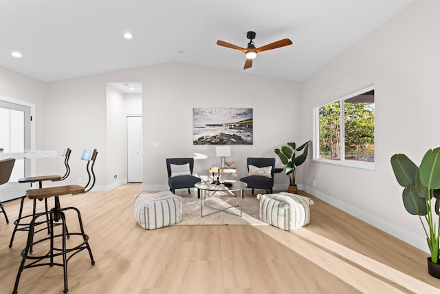 sitting room with light wood-style floors, baseboards, lofted ceiling, recessed lighting, and a ceiling fan