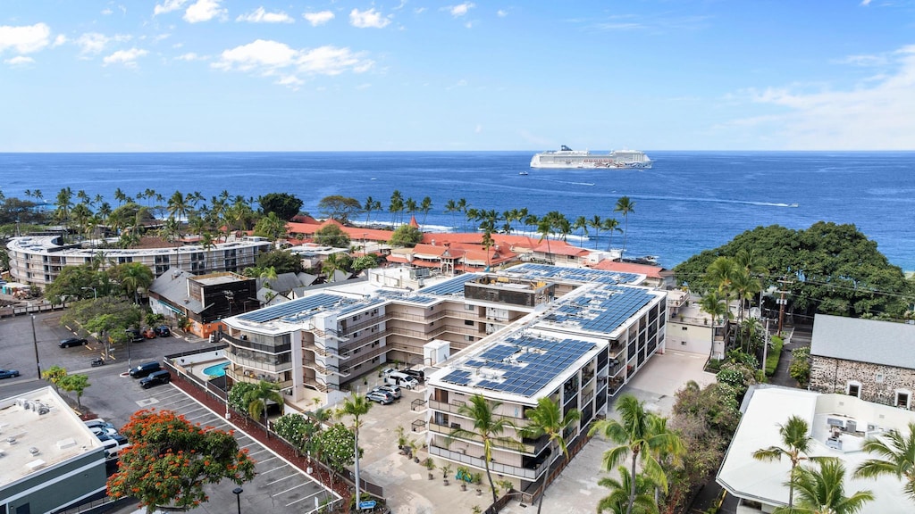 birds eye view of property with a water view