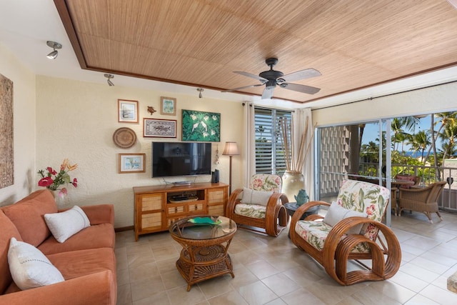 living room featuring wood ceiling, tile patterned flooring, ceiling fan, and a textured wall