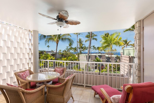 balcony featuring outdoor dining space and ceiling fan
