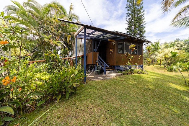 15-1429 22nd Ave, Keaau, HI 96749 - rear view of property featuring a lawn and entry steps