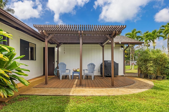 rear view of house featuring a lawn, a pergola, fence, and a wooden deck