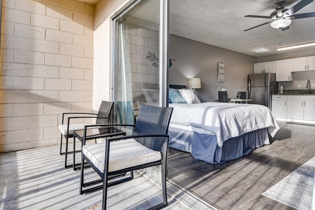 355 Kalanianaole St Unit 225, Hilo, HI 96720 - bedroom featuring freestanding refrigerator, a sink, and light wood-style flooring