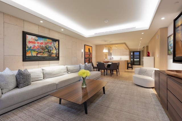 66-84 Kaunaoa Dr Unit A21, Kamuela, HI 96743 - living area featuring a tray ceiling, recessed lighting, and light colored carpet