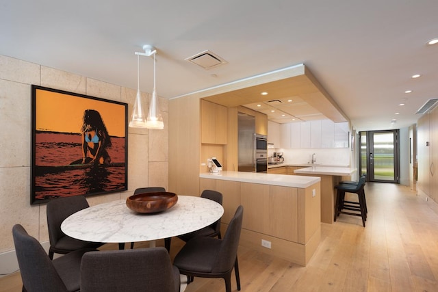 66-84 Kaunaoa Dr Unit A21, Kamuela, HI 96743 - dining space featuring light wood-type flooring and recessed lighting