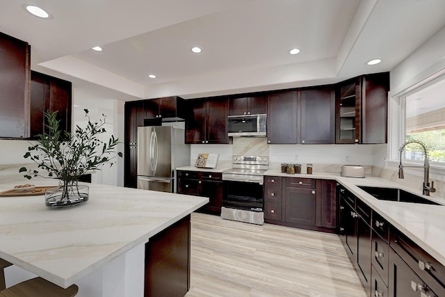 15-2047 32nd Ave, Keaau, HI 96749 - kitchen with a sink, a raised ceiling, light stone counters, stainless steel appliances, and recessed lighting