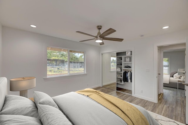 bedroom with recessed lighting, baseboards, ceiling fan, and light wood-style floors
