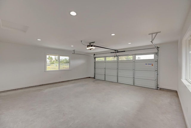 garage with recessed lighting and baseboards