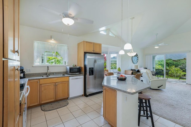 2110 Kaneka St Unit 73, Lihue, HI 96766 - kitchen featuring light tile patterned floors, a ceiling fan, a sink, open floor plan, and appliances with stainless steel finishes
