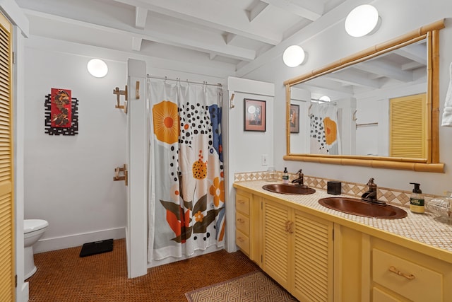 2321 Hoohu Rd, Koloa, HI 96756 - full bath with toilet, double vanity, beam ceiling, a shower with shower curtain, and baseboards