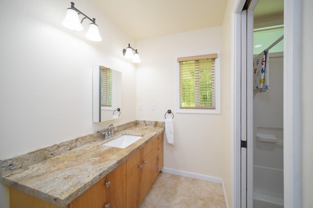 bathroom featuring vanity and baseboards