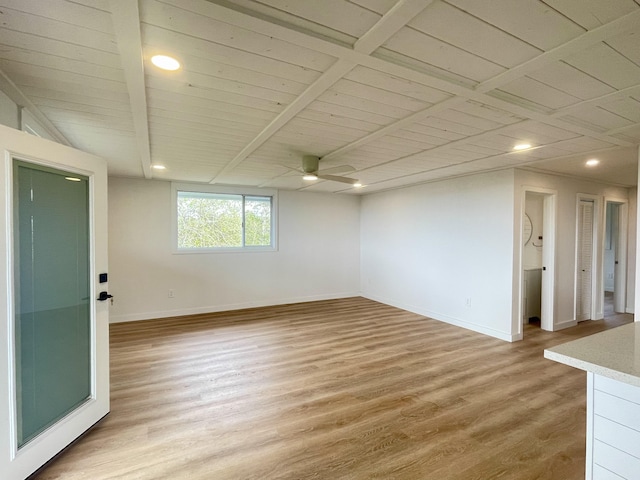 basement with baseboards, a ceiling fan, recessed lighting, and light wood-type flooring