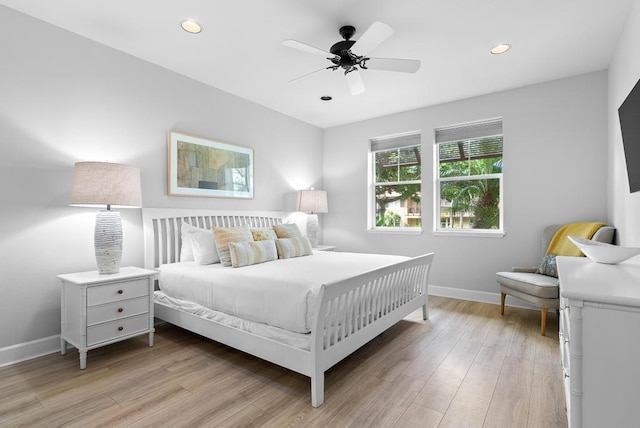bedroom with baseboards, recessed lighting, light wood-style floors, and a ceiling fan