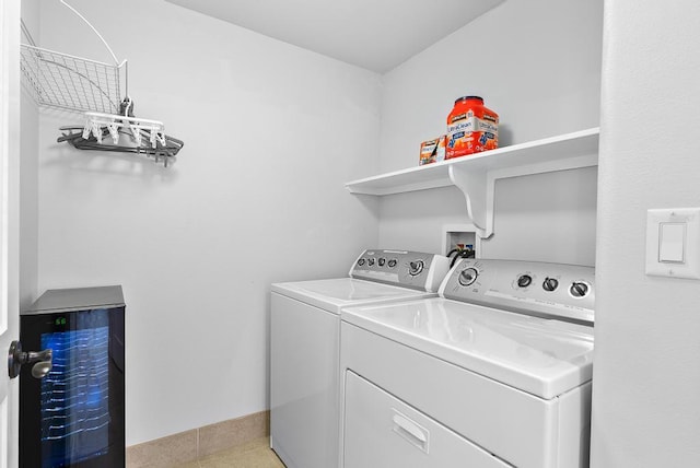 laundry room with laundry area and washing machine and clothes dryer