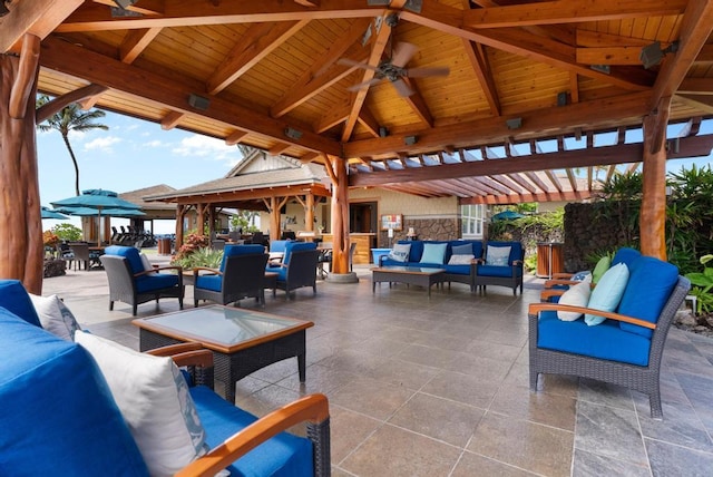 view of patio / terrace featuring a gazebo, an outdoor living space, and ceiling fan