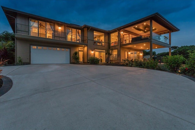 77-155 Kalaniuka St, Holualoa, HI 96725 - view of front facade with an attached garage, driveway, and a balcony