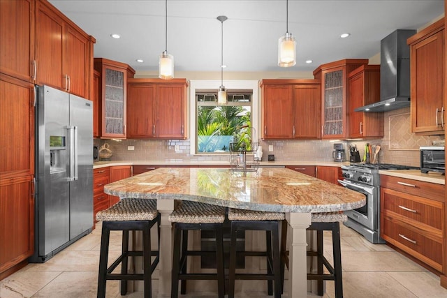77-155 Kalaniuka St, Holualoa, HI 96725 - kitchen featuring a kitchen breakfast bar, tasteful backsplash, stainless steel appliances, recessed lighting, and wall chimney exhaust hood