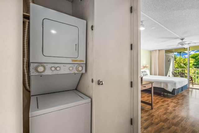 3811 Edward Rd Unit 1206, Princeville, HI 96722 - laundry area with estacked washer and dryer, ceiling fan, a textured ceiling, and wood finished floors