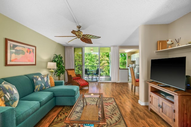 3811 Edward Rd Unit 1206, Princeville, HI 96722 - living area featuring wood finished floors, a textured ceiling, and ceiling fan