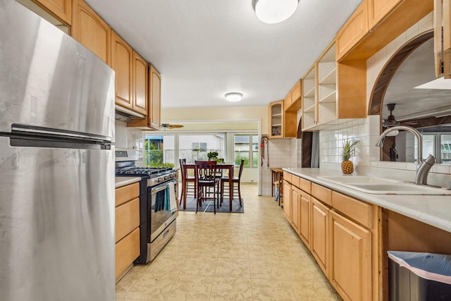 242 Koili Ln, Kapaa, HI 96746 - kitchen featuring a sink, stainless steel appliances, open shelves, ceiling fan, and decorative backsplash