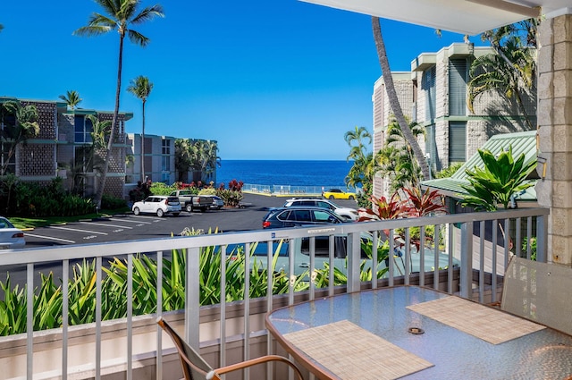 balcony featuring a water view