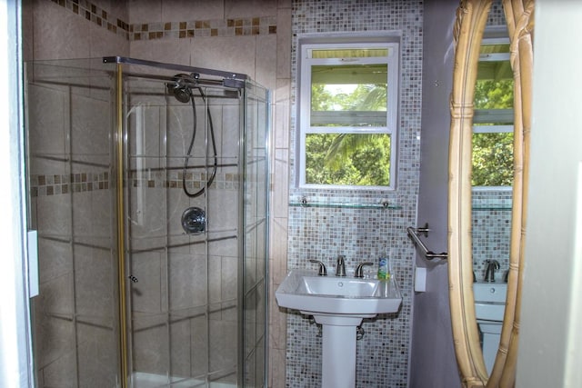 full bath featuring tile walls and a stall shower