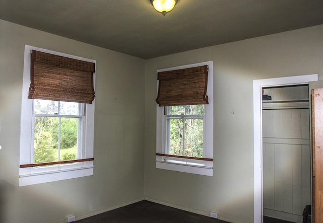 empty room featuring baseboards