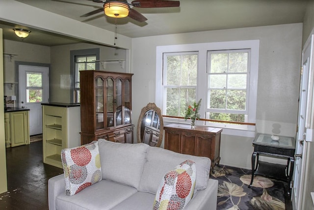 living room featuring a ceiling fan