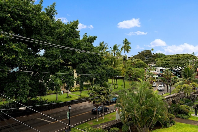 surrounding community featuring view of wooded area