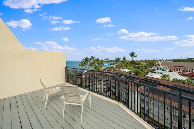 wooden deck with a water view