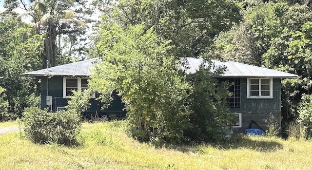 1360 Kaumana Dr, Hilo, HI 96720 - view of side of property with metal roof