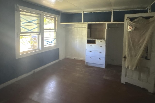 1360 Kaumana Dr, Hilo, HI 96720 - unfurnished bedroom with baseboards and dark wood-style floors