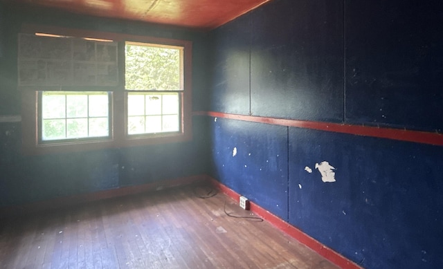 1360 Kaumana Dr, Hilo, HI 96720 - empty room with baseboards, plenty of natural light, and wood-type flooring