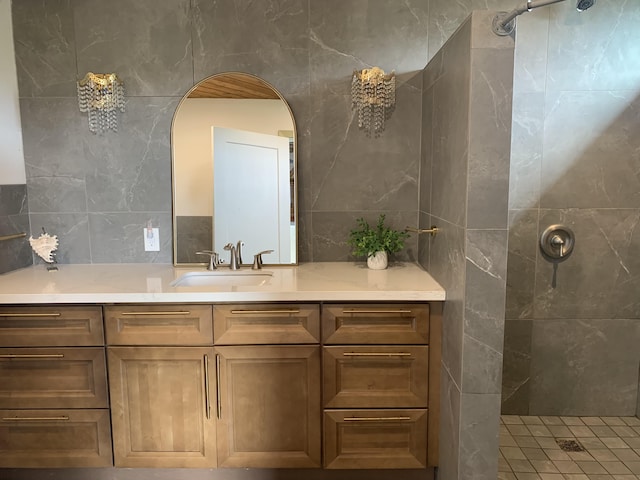 bathroom featuring a walk in shower, tile walls, and vanity