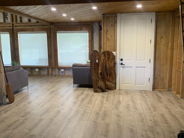 interior space featuring wooden walls, recessed lighting, wooden ceiling, and wood finished floors