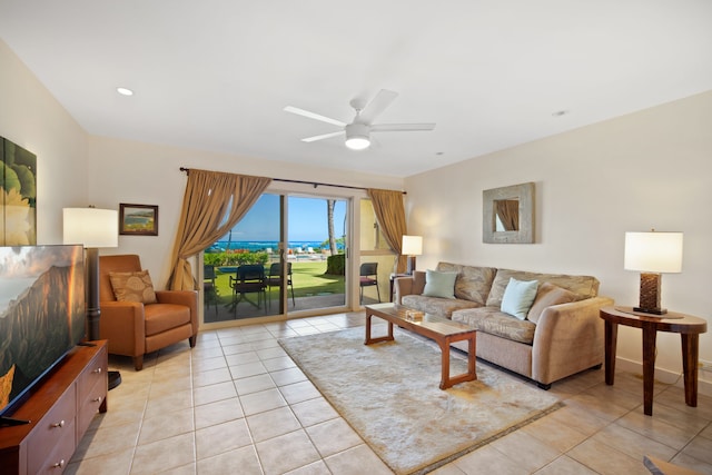 living area with light tile patterned floors, ceiling fan, and recessed lighting